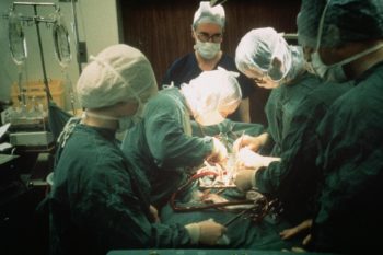 A Photograph of Surgeons Undertaking a Heart Transplant